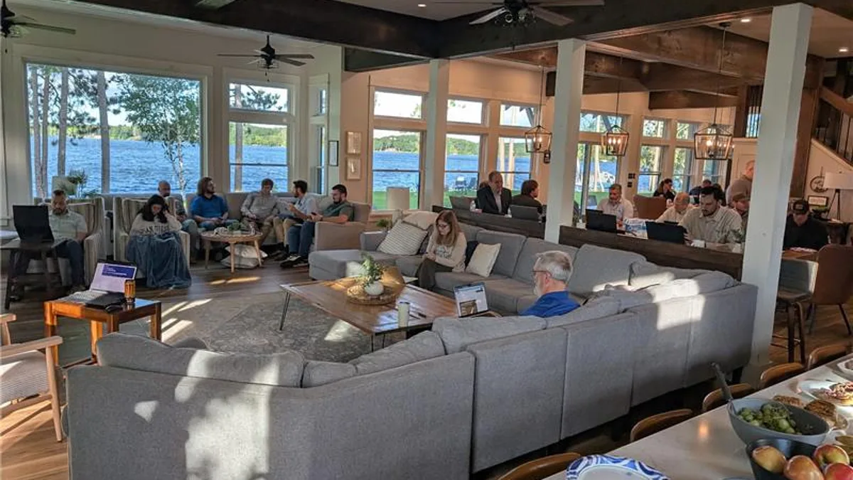 Business owners working through AI sessions at the AI Business Retreat 2026 at a lakeside lodge in Spooner, Wisconsin