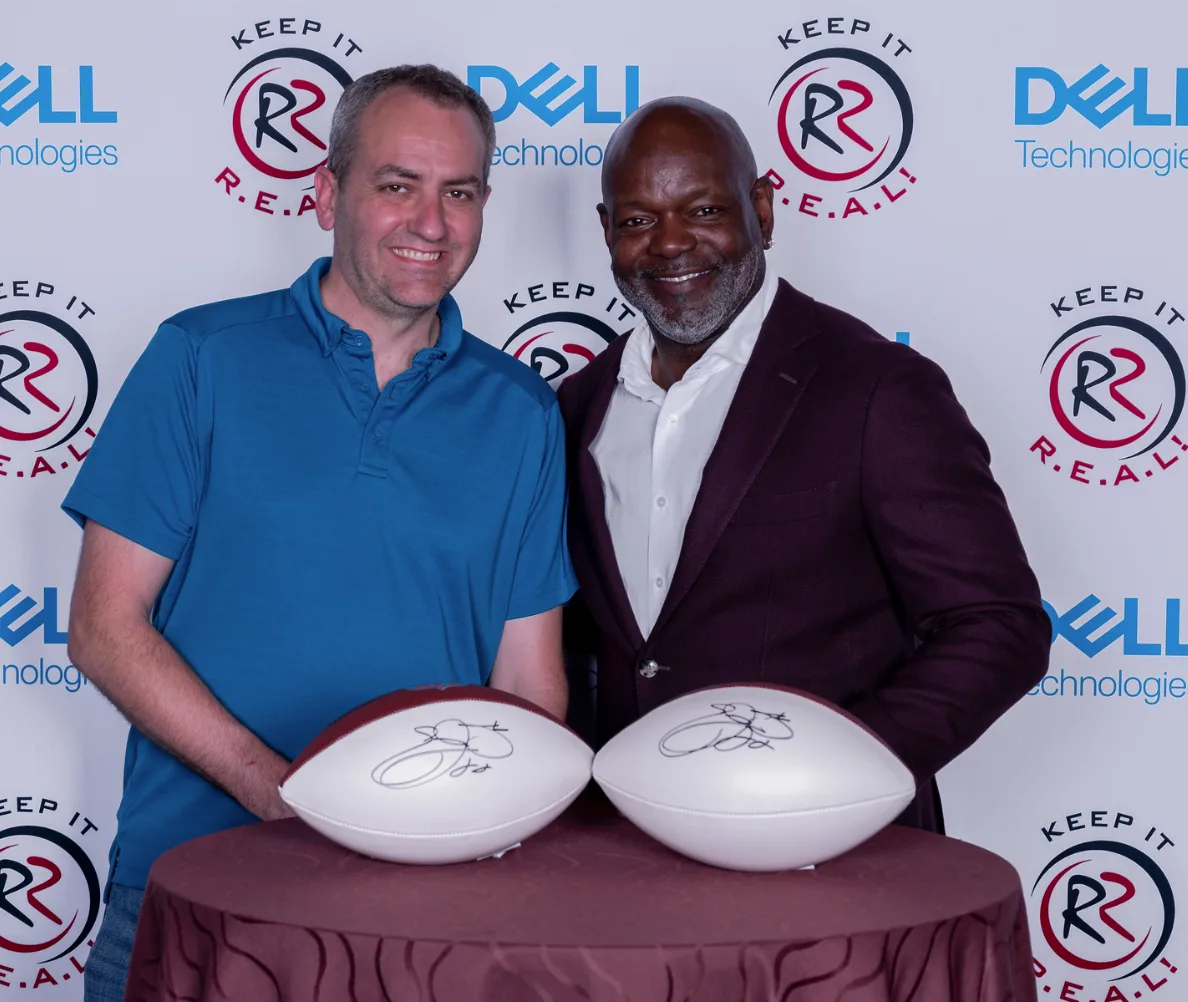 Greg Brainerd with NFL Hall of Famer Emmitt Smith and signed footballs