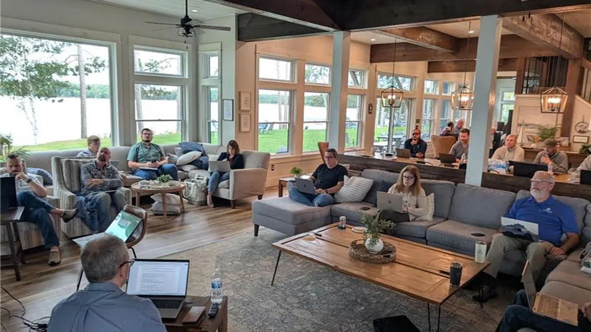 Business owners working through an AI session at the AI Business Retreat 2026 in Spooner, Wisconsin