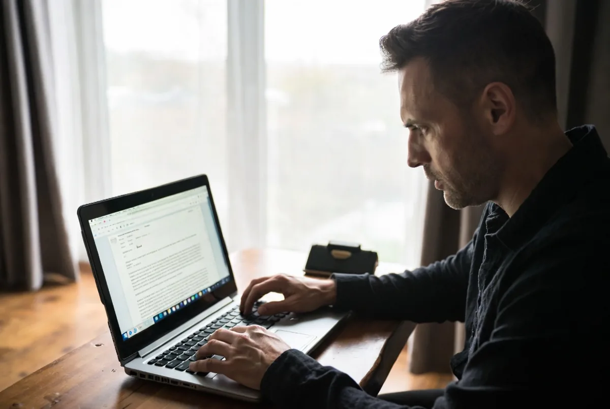 A business owner reading a suspicious email