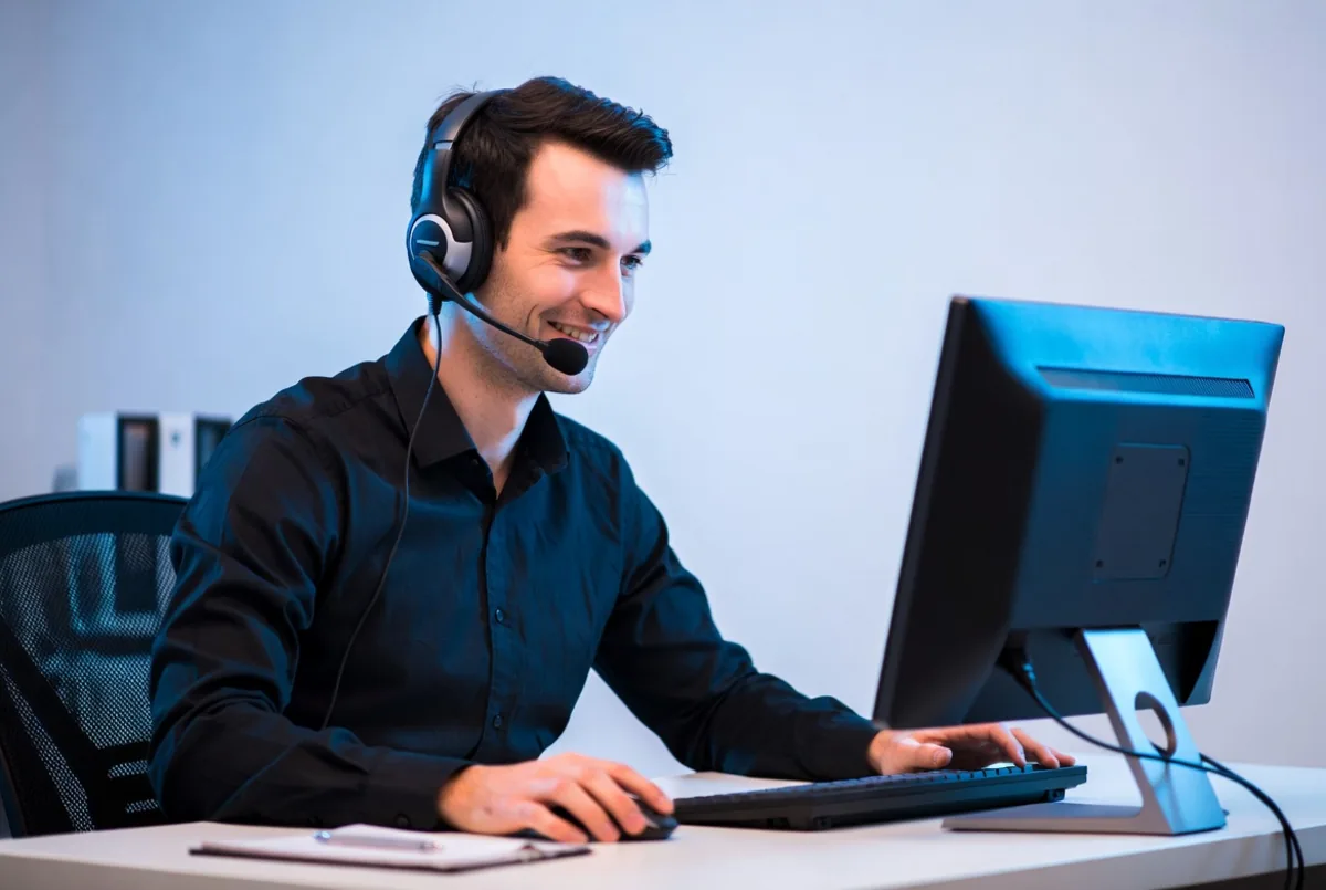 A friendly help desk technician on a call