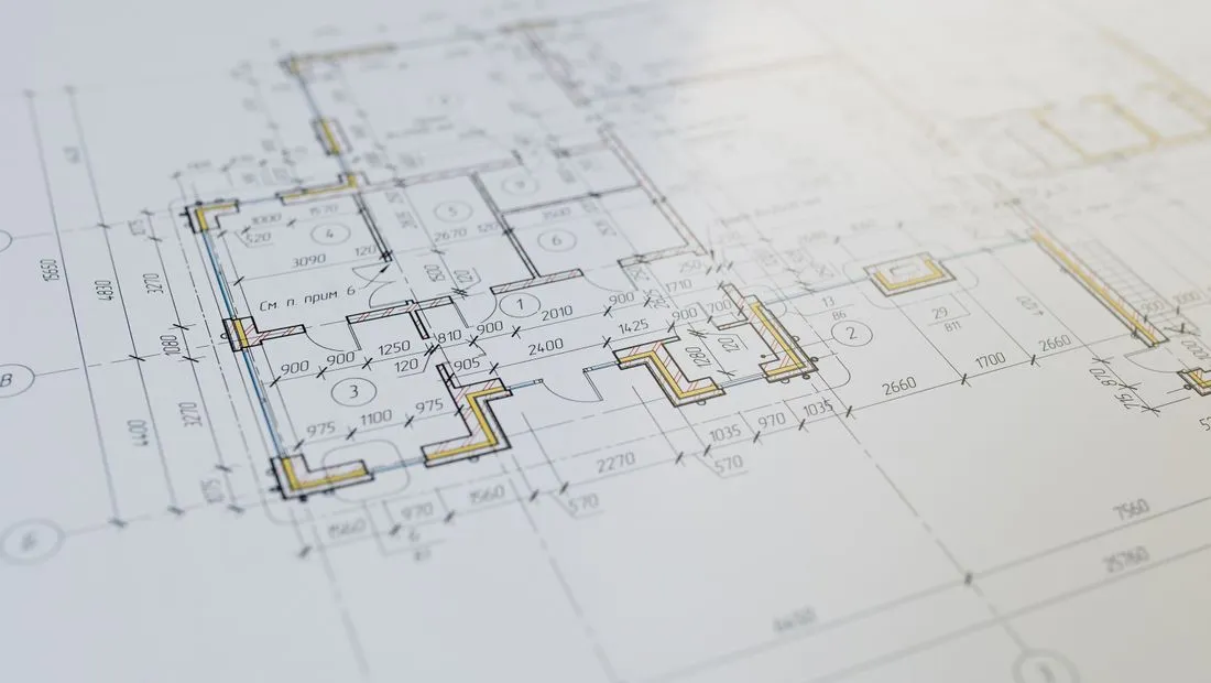 Construction blueprints and project plans on a desk