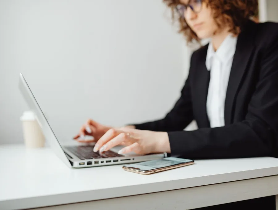 An attorney working securely on a laptop — Braintek cybersecurity and confidentiality for law firms