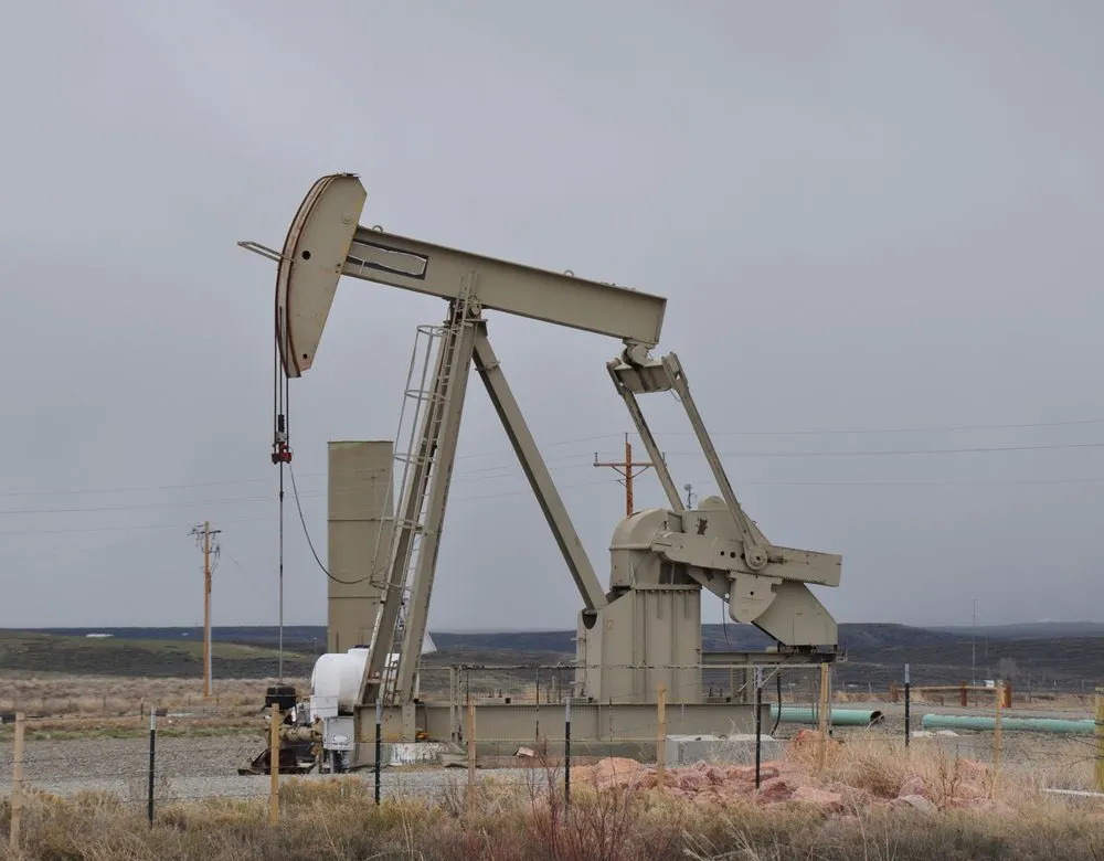 An oil pumpjack in a Texas field — Braintek IT for Houston oil, gas, and energy firms