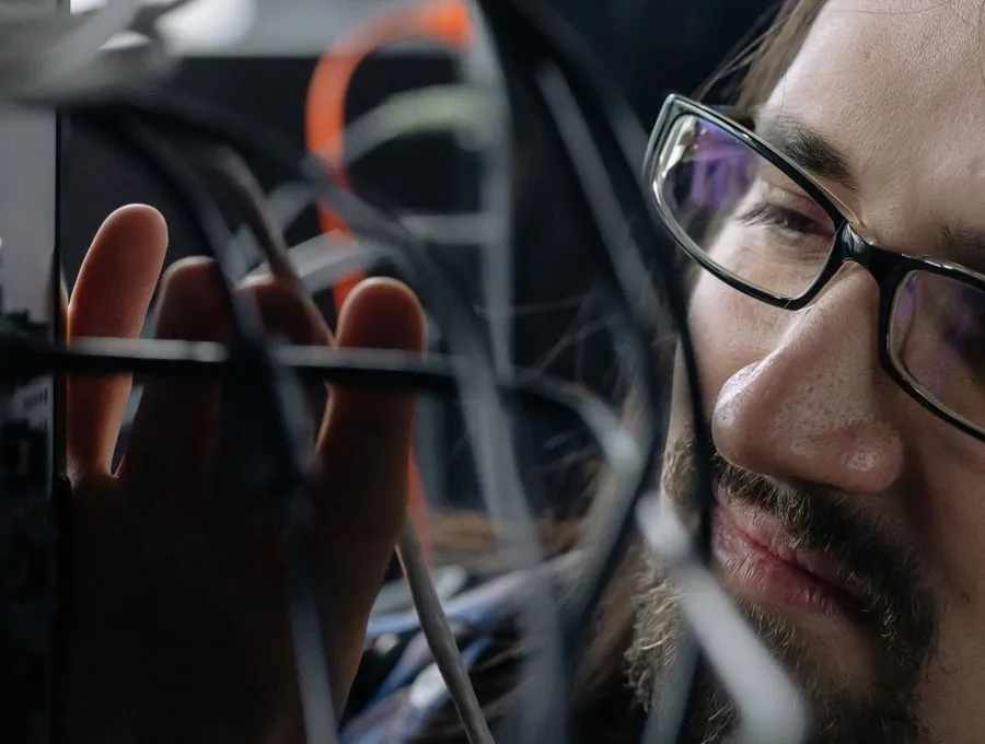 A Braintek technician working hands-on in a client server room