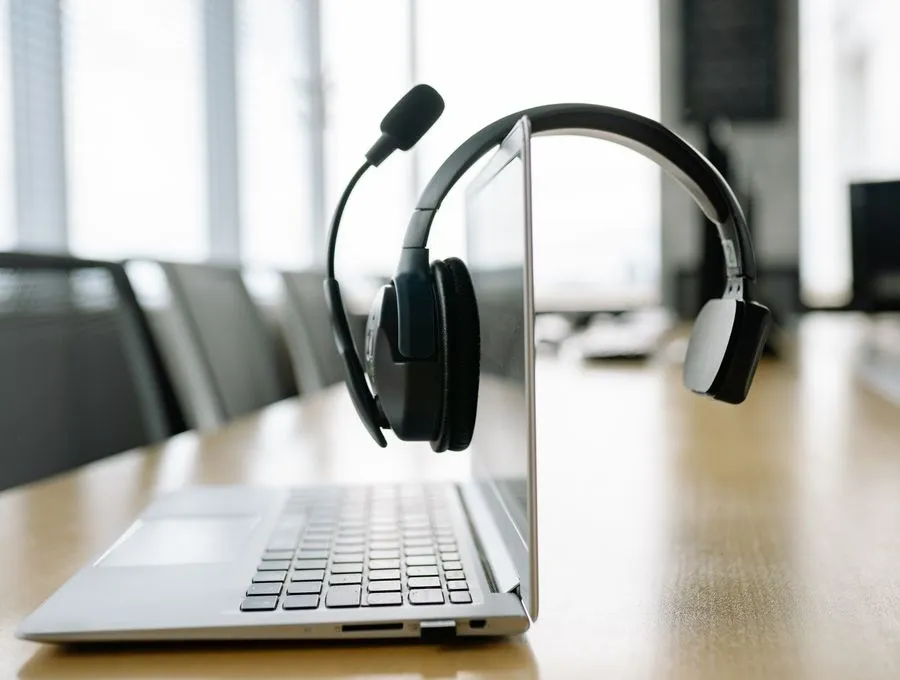 A business VoIP headset ready at a Houston office desk