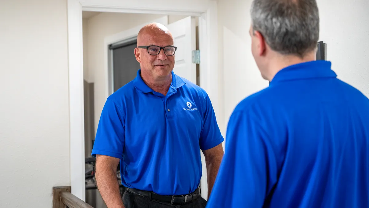 Braintek technician consulting with a business owner