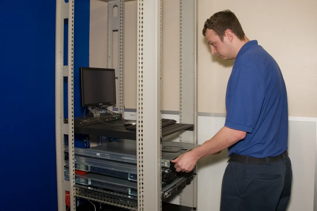 Braintek technician installing a server in a client rack